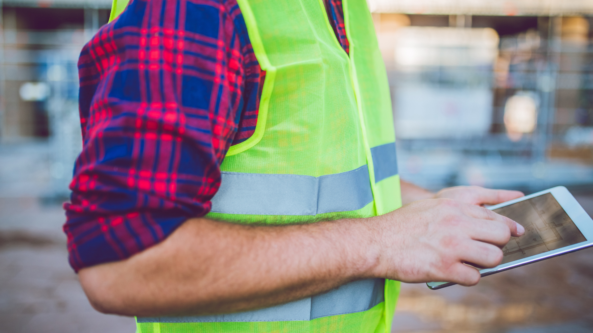 A construction worker using a tablet 